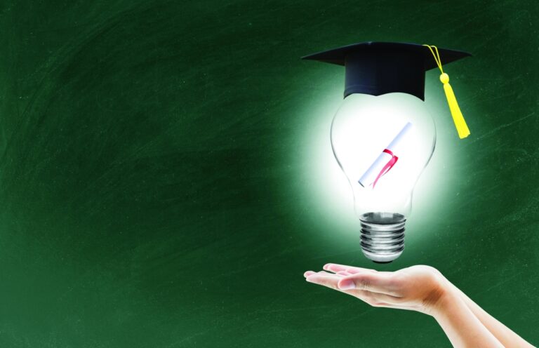 Hand,Holding,Light,Bulb,With,Certification,For,Graduation,Shows,The