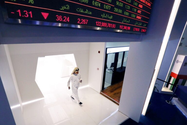 An investor arrives at the Dubai Financial Market in Dubai
