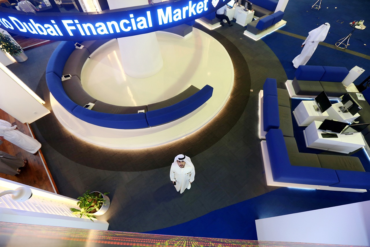 FILE PHOTO: Investor looks at the screen at the Dubai International Financial Market in Dubai