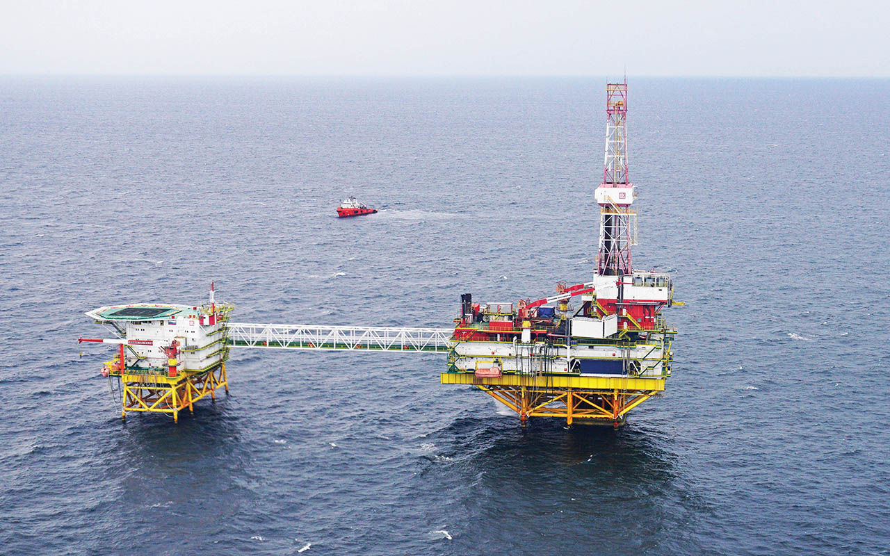 Employees of an oil platform in the Baltic Sea take part in the early voting for the parliamentary election