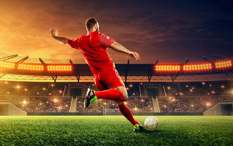 Soccer,Player,Kicks,A,Ball.,Action.,Sports,Event.,Night,Soccer