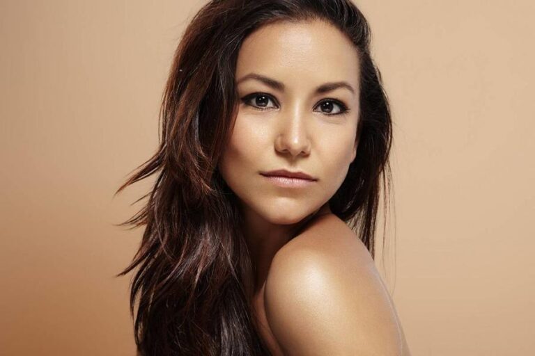latin woman with ideal skin on a beige background