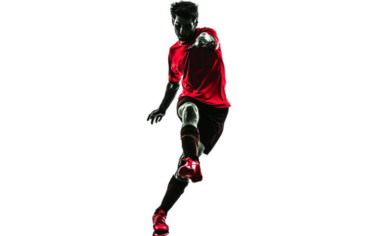 One,Brazilian,Soccer,Football,Player,Young,Man,Kicking,In,Silhouette
