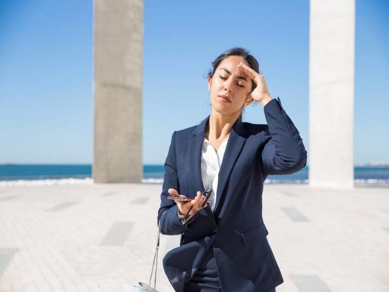 Frustrated business lady suffering from heat
