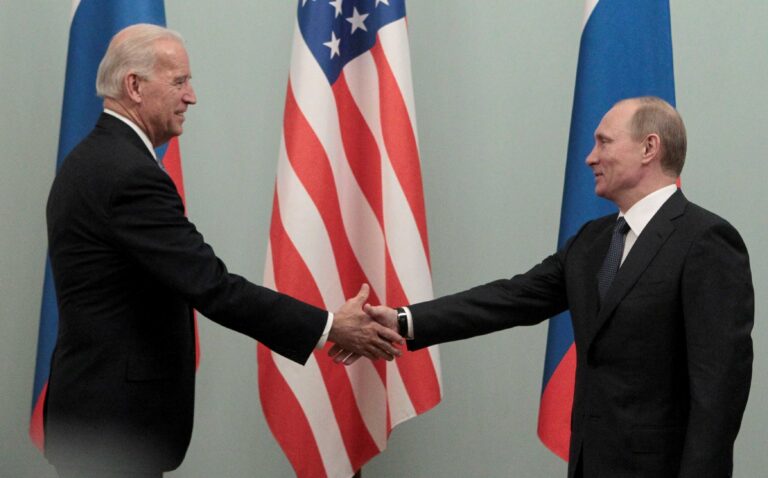FILE PHOTO: FILE PHOTO: Russian Prime minister Putin shakes hands with U.S. Vice President Biden during their meeting in Moscow