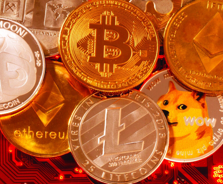 FILE PHOTO: Representations of cryptocurrencies Bitcoin, Ethereum, DogeCoin, Ripple, Litecoin are placed on PC motherboard in this illustration taken