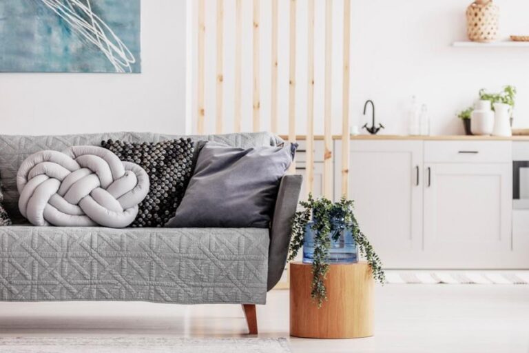 Open,Plan,Studio,Apartment,With,Small,White,Kitchen,And,Living