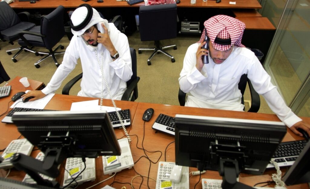 Saudi traders monitor the stock in Riyadh