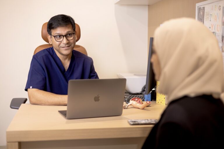 Dr. Partha Sarathi Das, Medical Director and Consultant in Reproductive Endocrinology and Infertility at Orchid Fertility, during a consultation with a patient.jpg